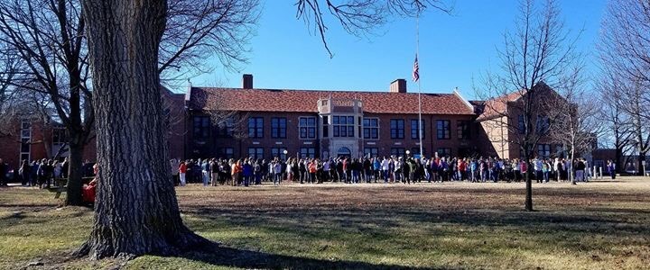 Students stand in solidarity during the 17 minutes of silence for the 17 victims. 