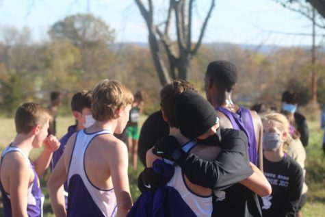 Elliot Muhlenbruck (23) embraces teammate Evan Hughes (23) after the team found out they made it to state.