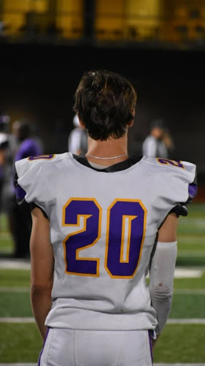 Weston Howe (12) looks out at the Hickman football field.