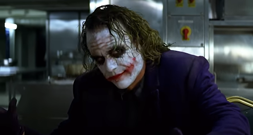 Heath Ledger’s Joker smiles menacingly at the camera. Christopher Nolan, The Dark Knight, 2008.