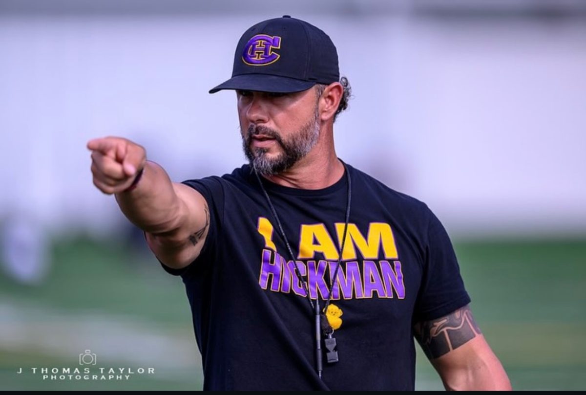 New Hickman head football coach Justin Conyers points the way during practice. 
