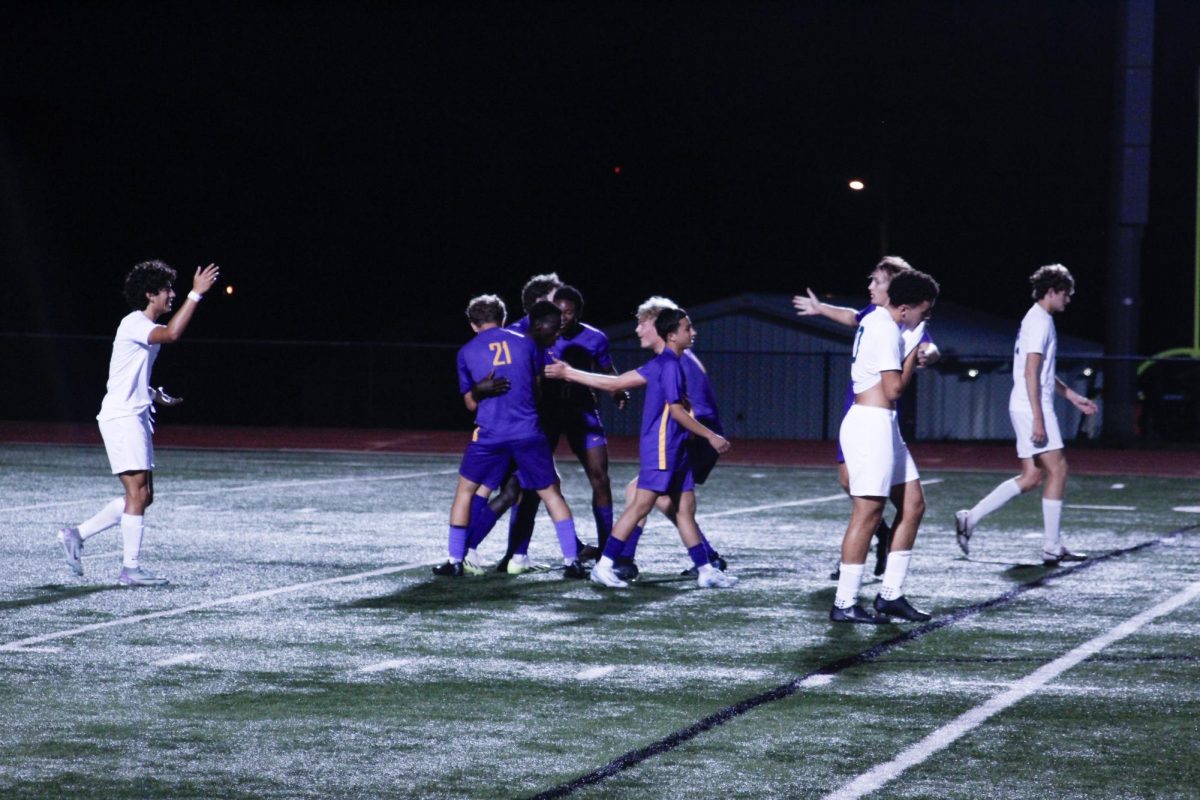 The Kewpies celebrate after a goal from Braka Grodya (12) in their loss against Rock Bridge on Sept. 24 (Ben Drury)