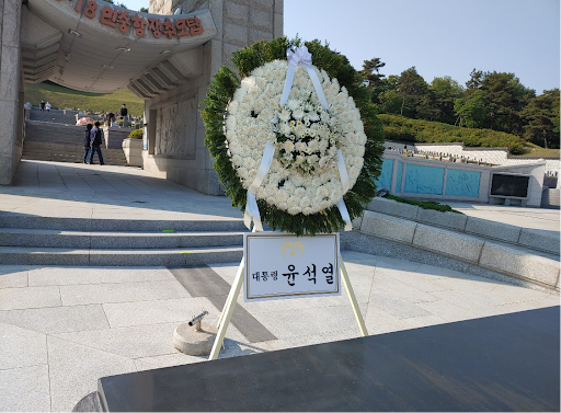 This was a picture taken by my brother in 2022 after President Yoon was elected. The flowers were sent as a celebration of his presidential victory. What makes this photo so paradoxical is that the President’s name was mounted in the very same memorial union dedicated to the hundreds of Gwangju citizens who fought for democracy in 1980. 