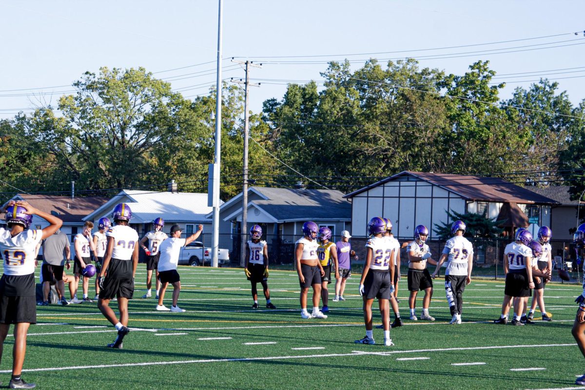 Coach Justin Conyers leads a drill at a practice during the 2024 season