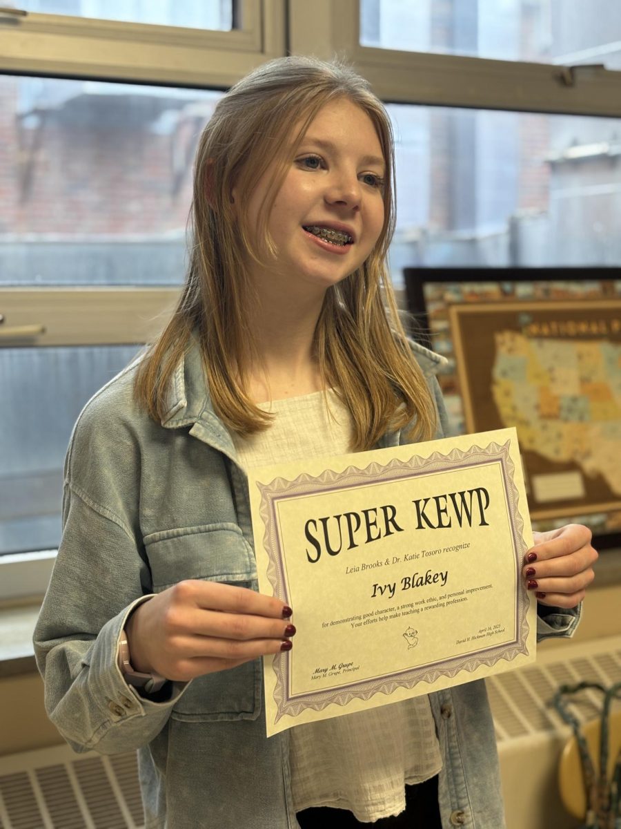 Sophomore Ivy Blakey poses with her most recent Super Kewp Award, given to her by teachers Leia Brooks and Katie Tosoro.