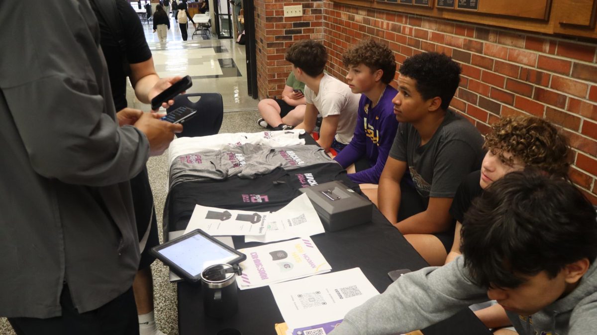 Hickman Business Principles Students in the Traditions Lobby during lunch selling products they have made during the class