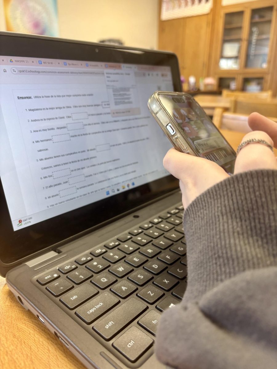 A student uses their phone during the school day