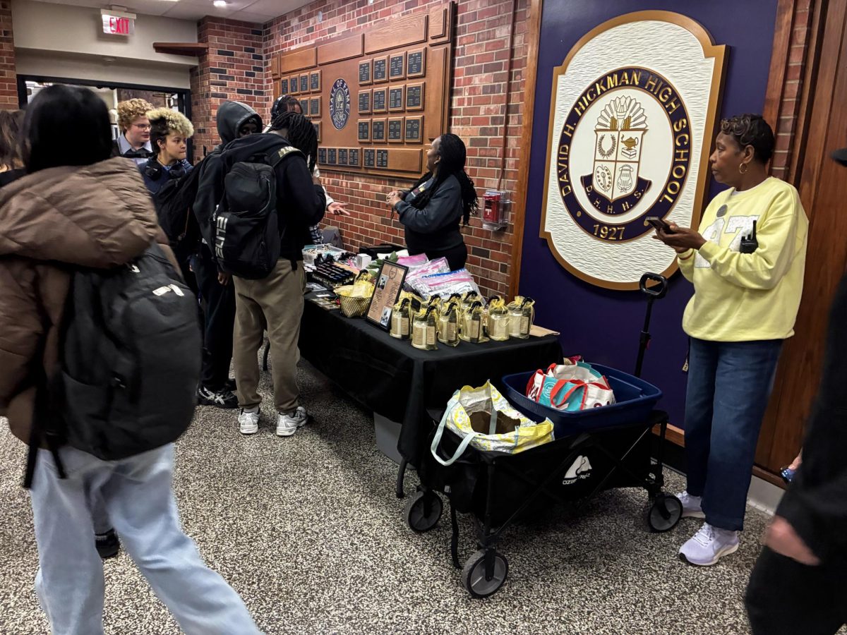 Hickman students wait in line at the Black Business Expo, an event held during lunches last week in the traditions lobby, with the purpose of celebrating black businesses. 