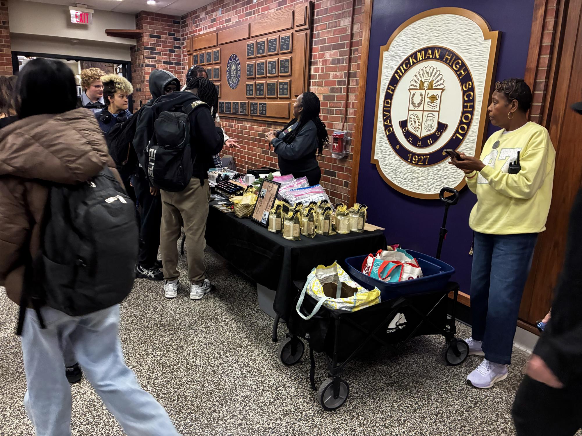 Hickman students wait in line at the Black Business Expo, an event held during lunches last week in the traditions lobby, with the purpose of celebrating black businesses. 
