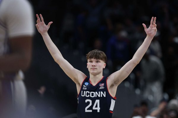 Braylon Mullins celebrates after making the game winning three-pointer in UConn's victory against Duke in the Elite Eight, the shot punched their ticket to the Final Four.