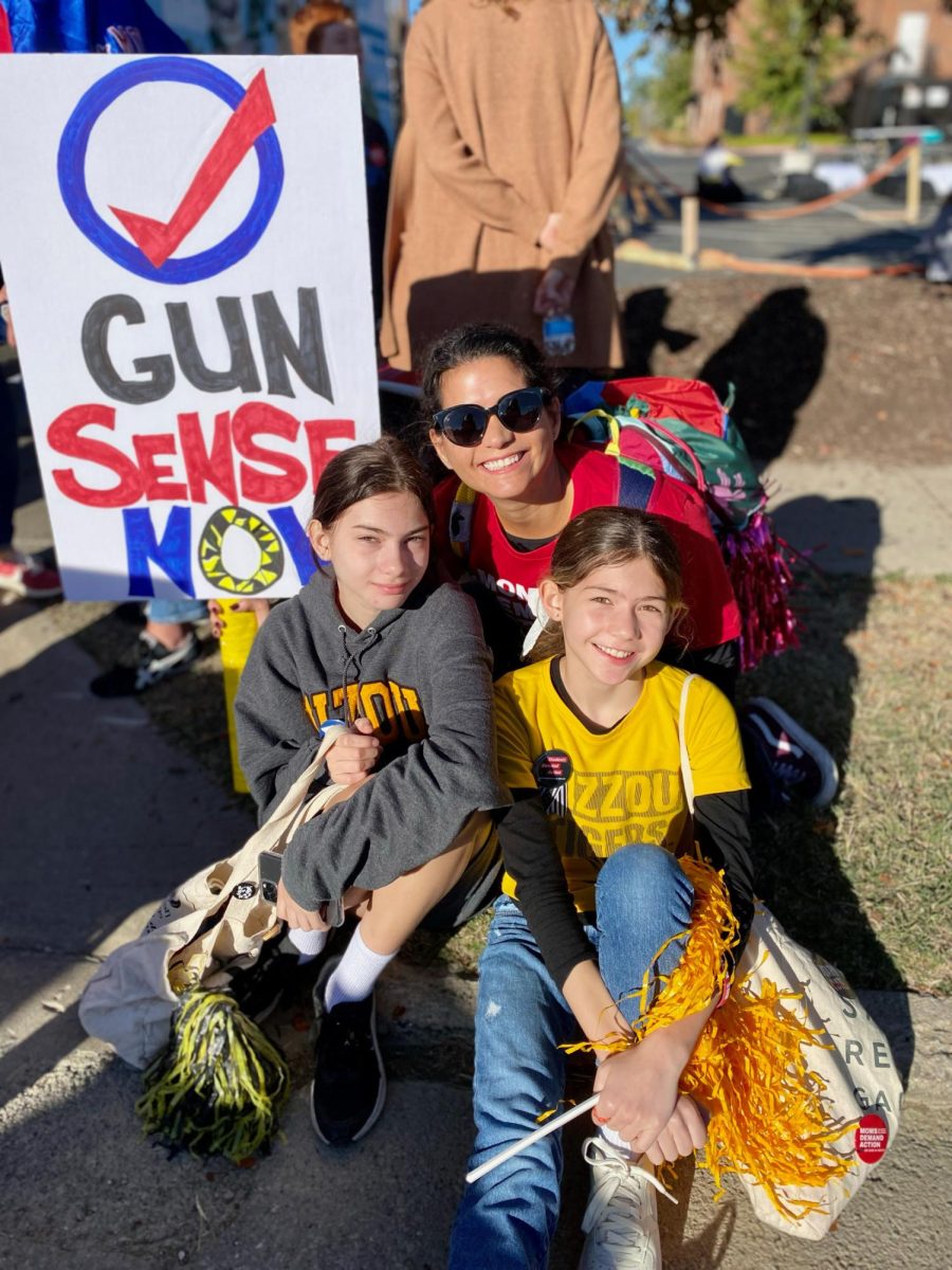 Cecilia Brown (left) with mother Aimee Davenport and younger sister Stella Brown at a Moms Demand Action protest on October 21, 2023 (Photo courtesy of Cecilia Brown)
